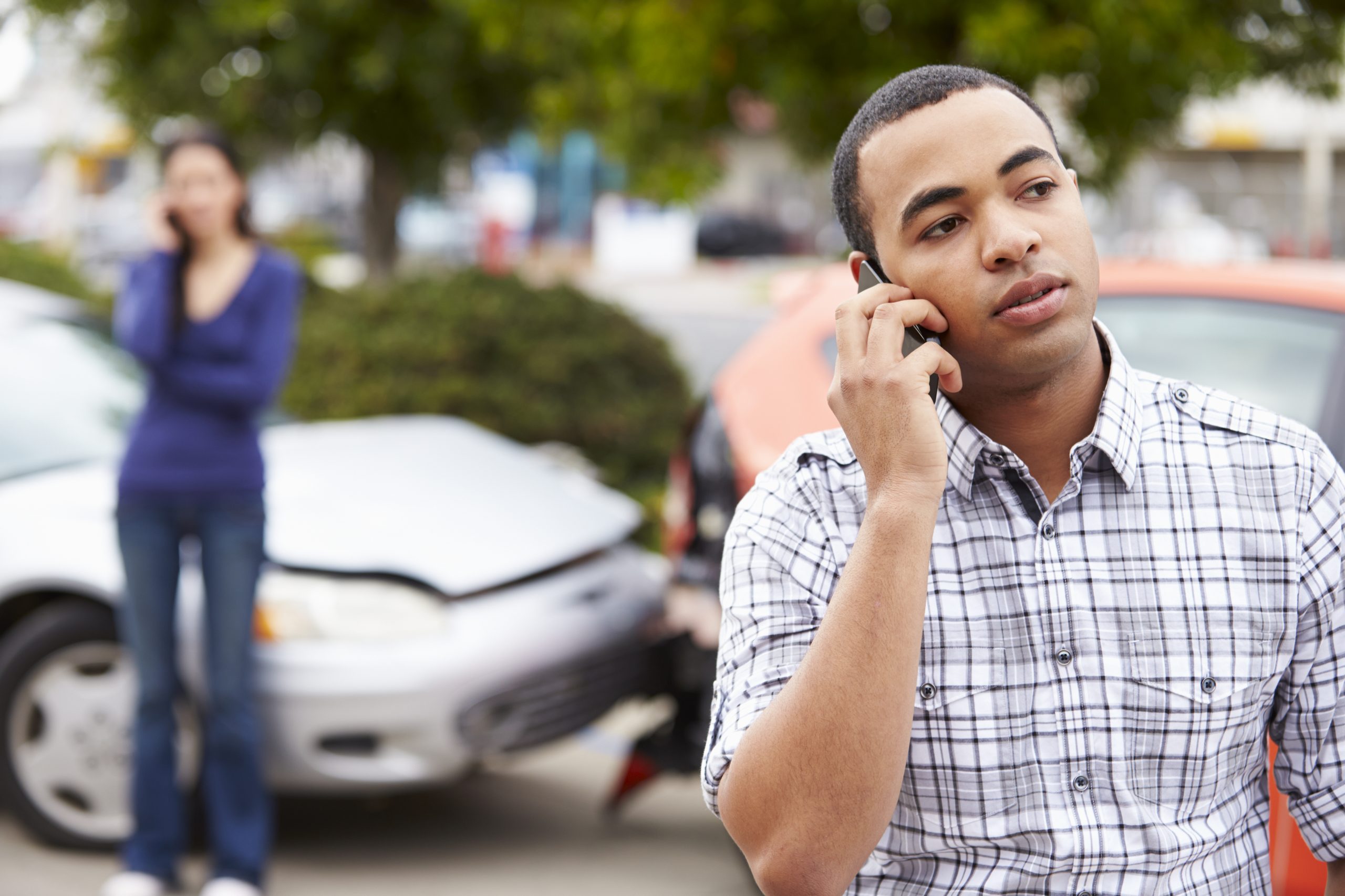 Man on phone at accident scene