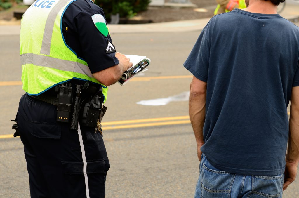 Police Officer Completing Auto Accident Report