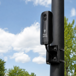 a Flock Safety camera mounted on a black pole