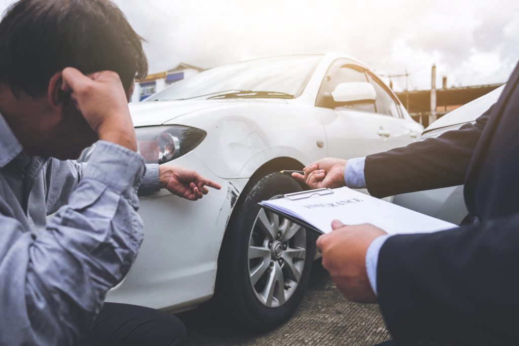Reviewing property damage of hit and run accident with an insurance adjuster