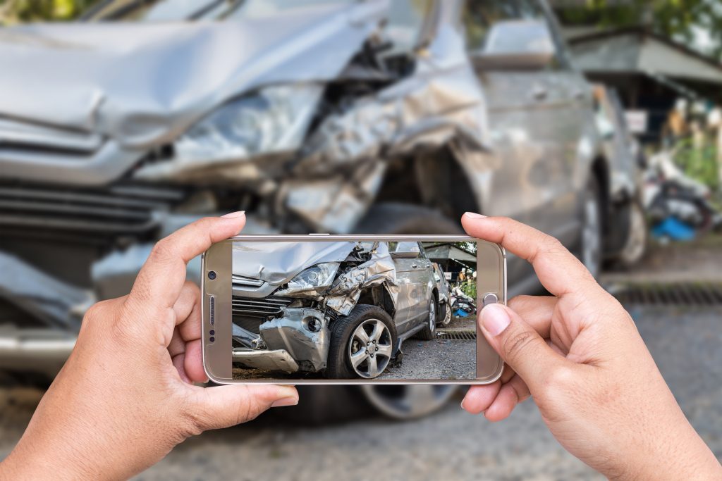 Taking photo of car at the scene of the accident